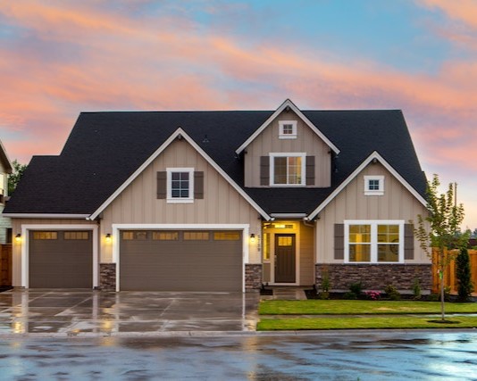The exterior of a home at dusk, after a thorough pressure washing.